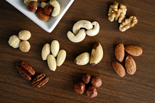 Assorted nuts including almonds, cashews, walnuts, and pistachios